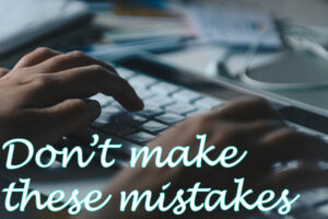 Website designer in Ocean County image of hands on keyboard with text reading "Don't make these mistakes" in script at bottom