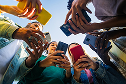 Group of people using mobile phones browsing websites in Ocean County