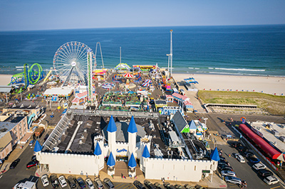 Aerial view of boardwalk and rides located in the Seaside Park real estate market